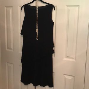 Black sleeveless dress with flouncy layers